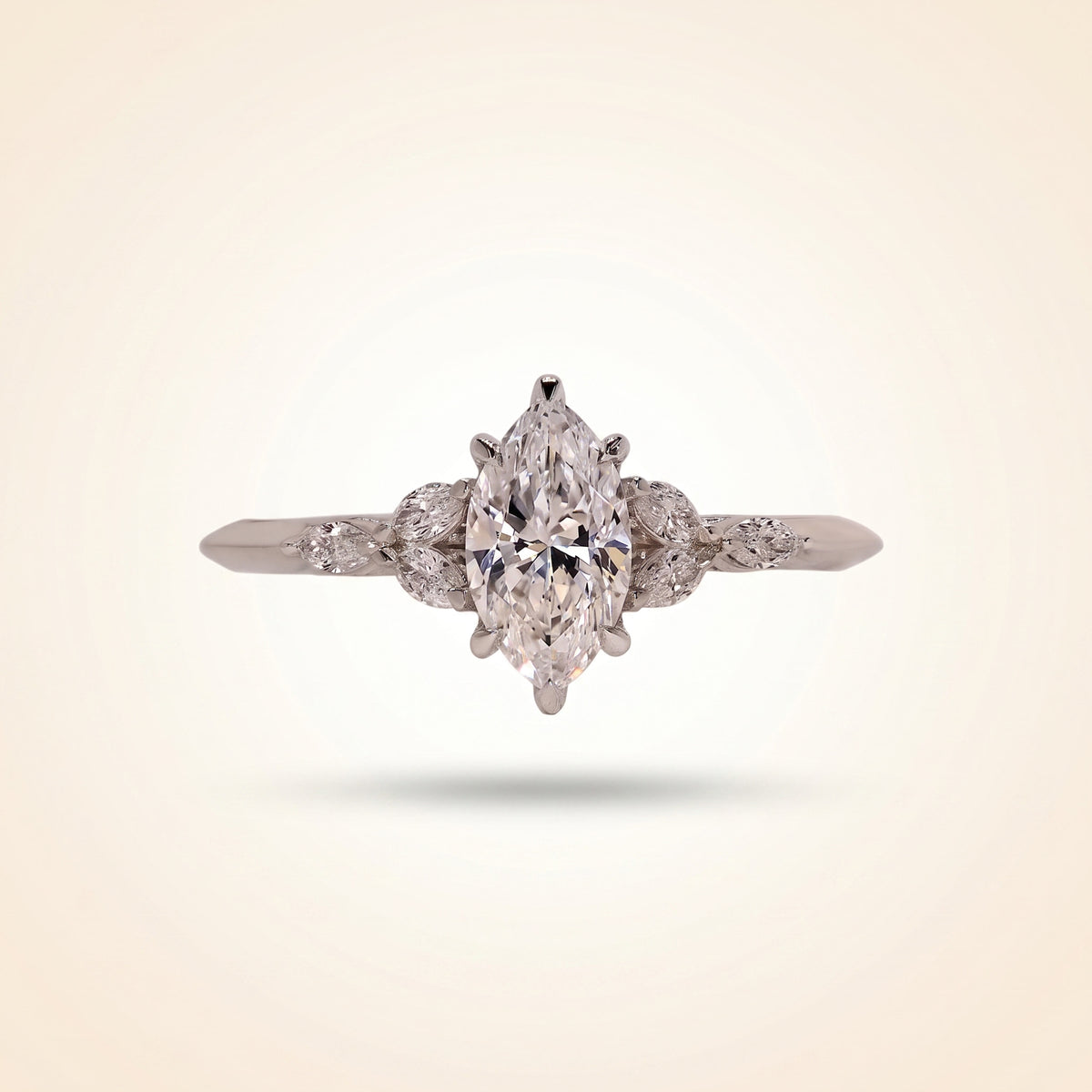 marquise cut diamond engagement ring with leaf cluster side stones