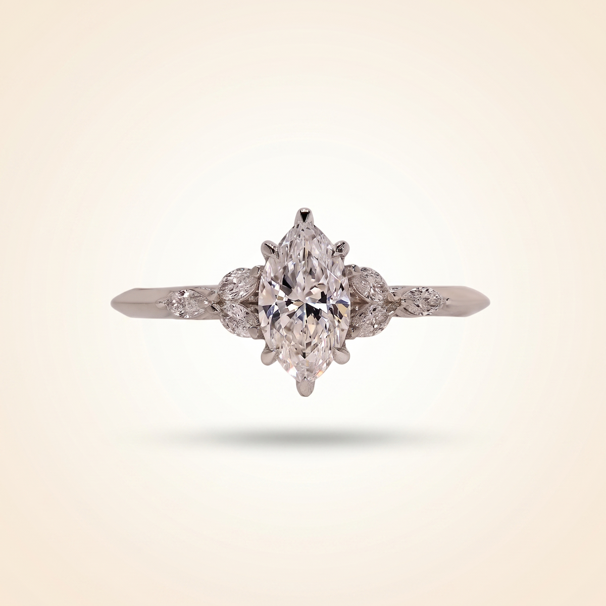 marquise cut diamond engagement ring with leaf cluster side stones