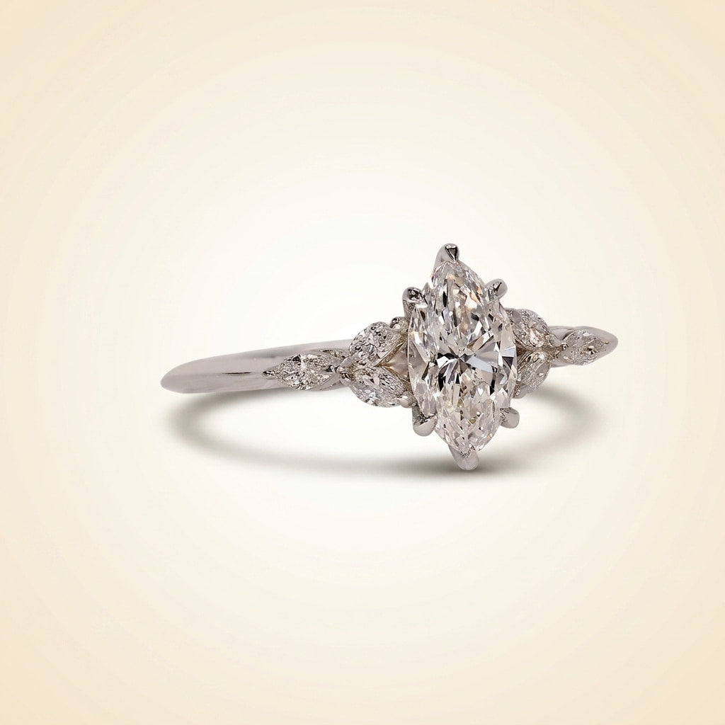 marquise cut diamond engagement ring with leaf cluster side stones