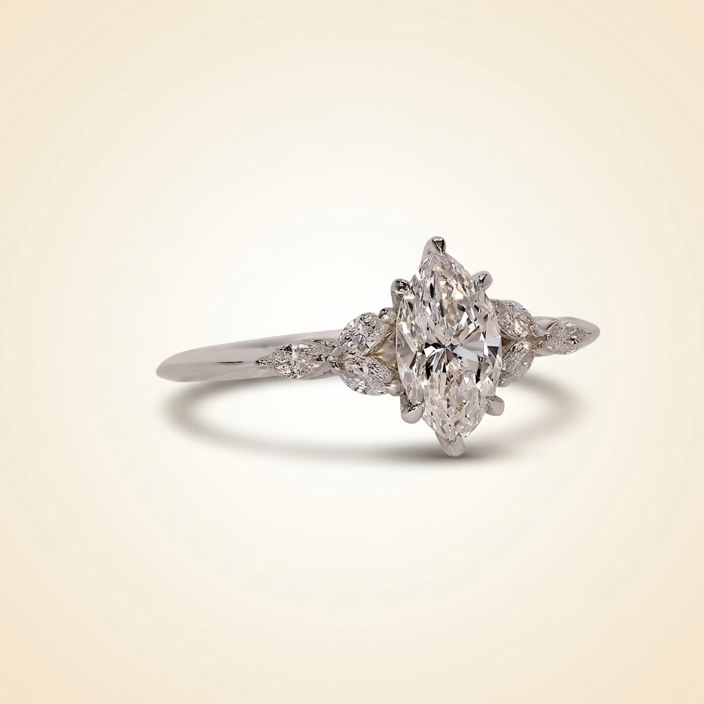 marquise cut diamond engagement ring with leaf cluster side stones