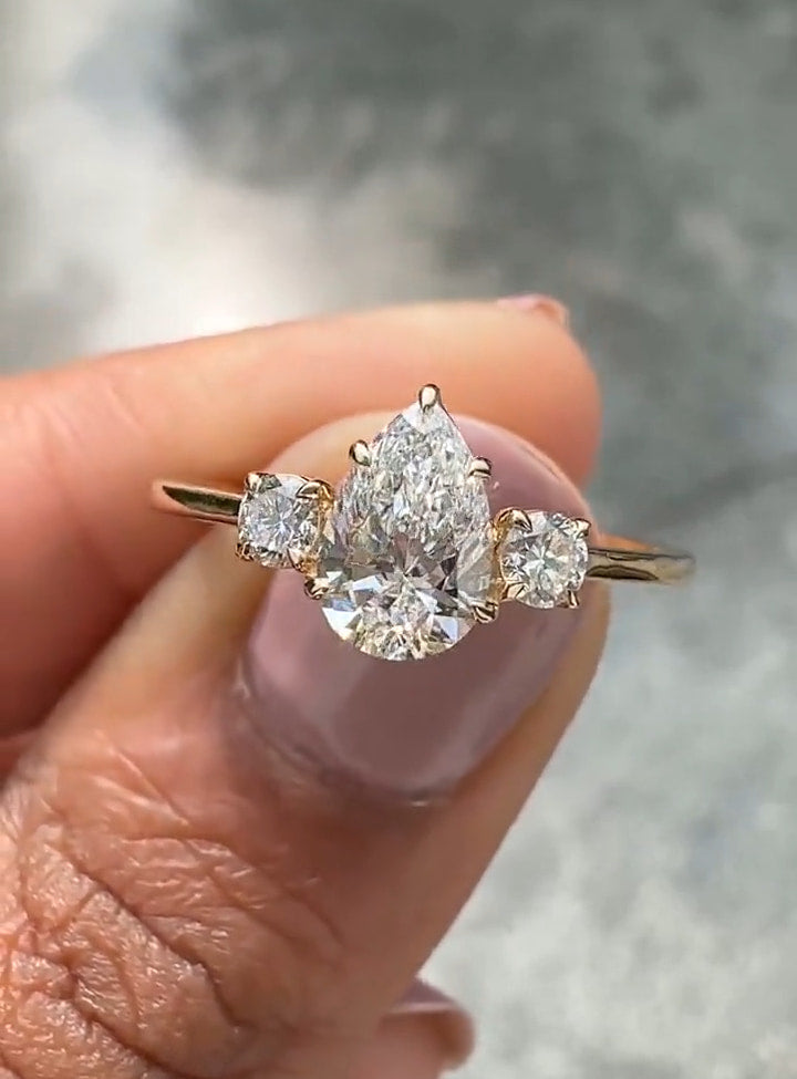 pear cut three stone diamond engagement ring