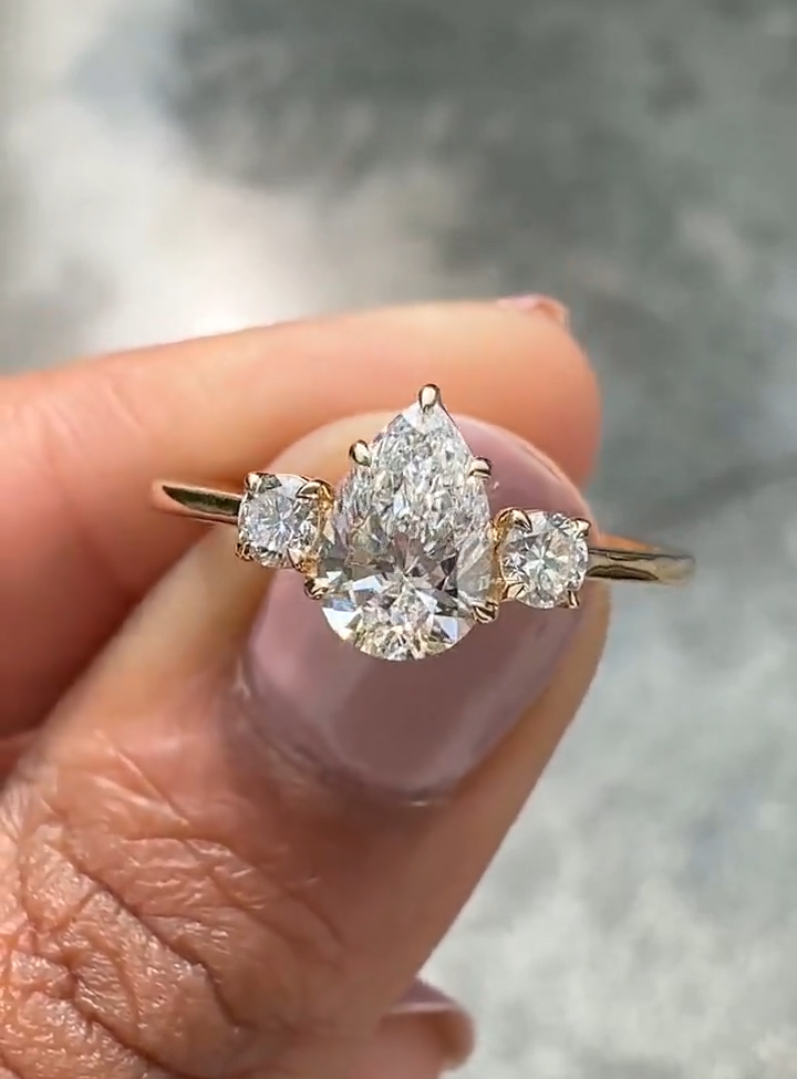 pear cut three stone diamond engagement ring