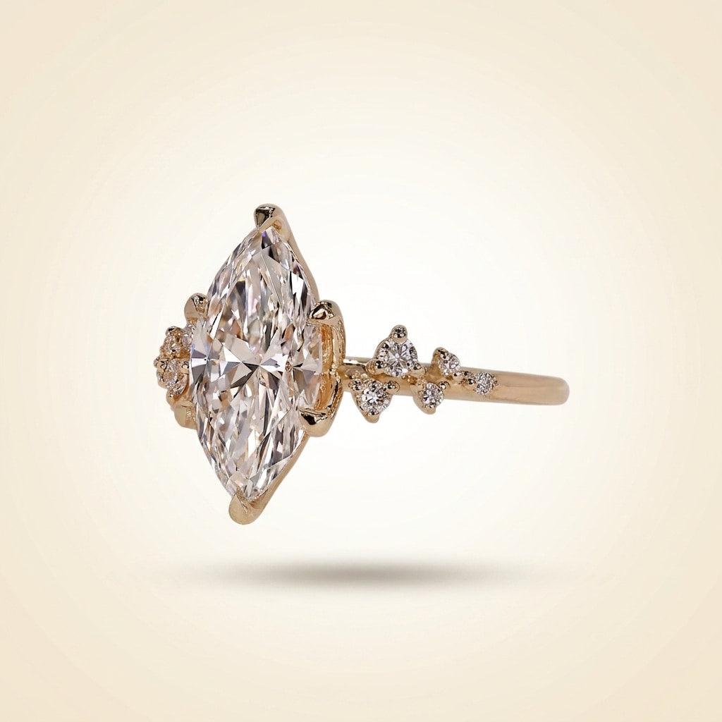 marquise cut diamond engagement ring with cluster side accent