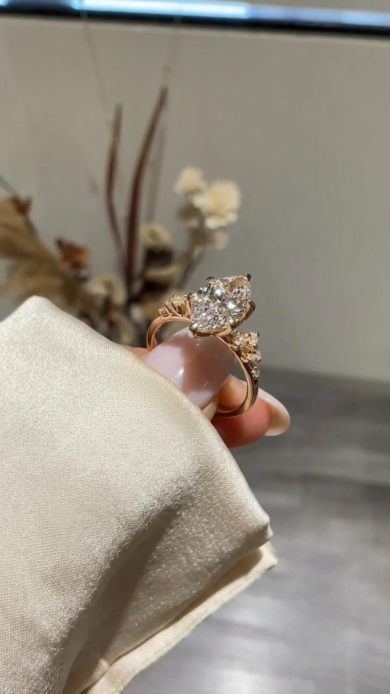 marquise cut diamond engagement ring with cluster side accent
