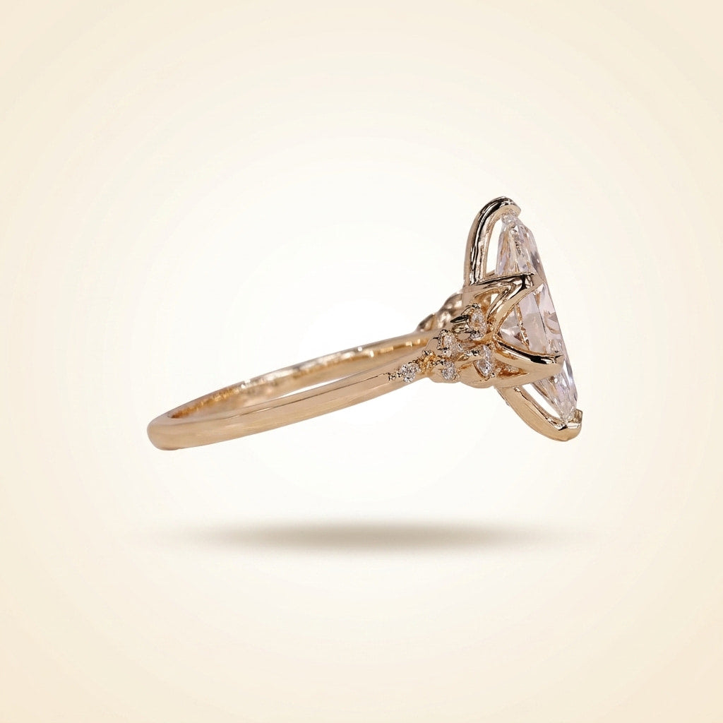 marquise cut diamond engagement ring with cluster side accent