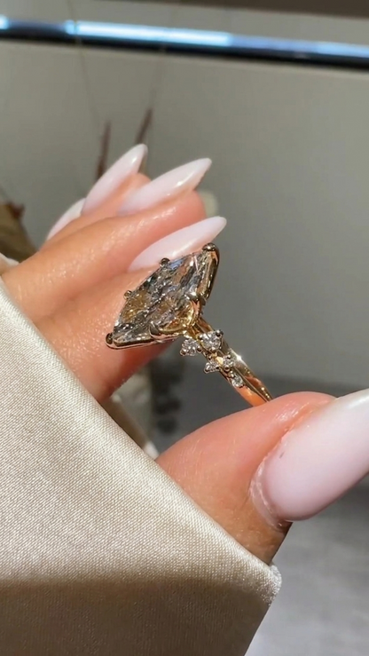 Marquise Cut Diamond Engagement Ring with Cluster Side Accent
