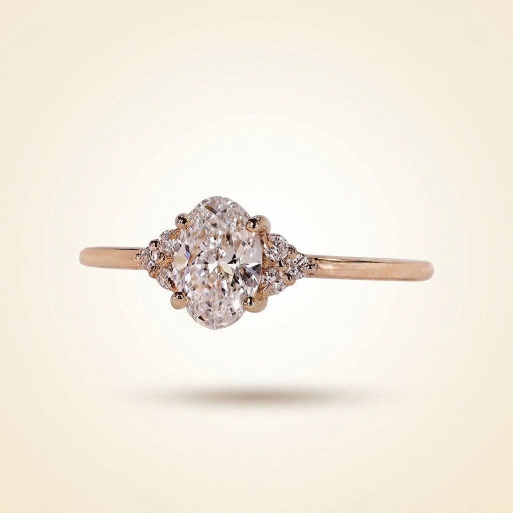oval cut diamond engagement ring with cluster side accents