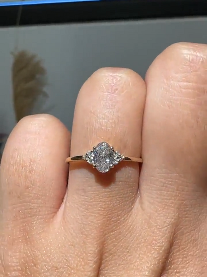 Oval Cut Diamond Engagement Ring with Cluster Side Accents