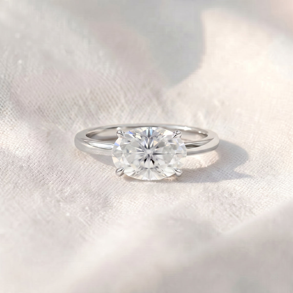 east-west oval lab diamond solitaire engagement ring