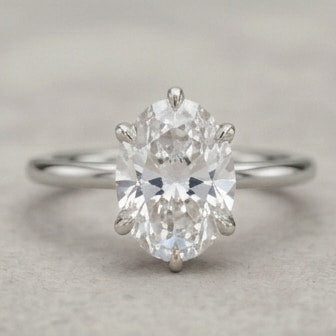 oval lab grown diamond lotus basket solitaire engagement ring