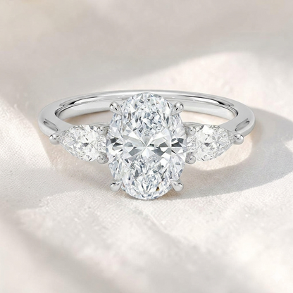 Oval Lab Grown Diamond Three Stone Engagement Ring with Pear Side Stones