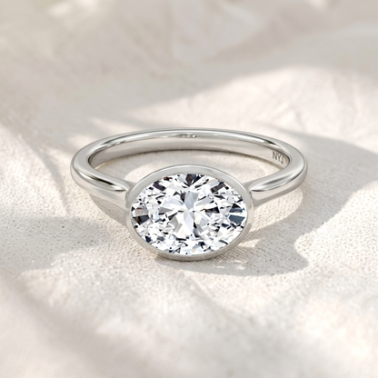 Oval Cut East-West Bezel Set Lab Grown Diamond Solitaire Engagement Ring